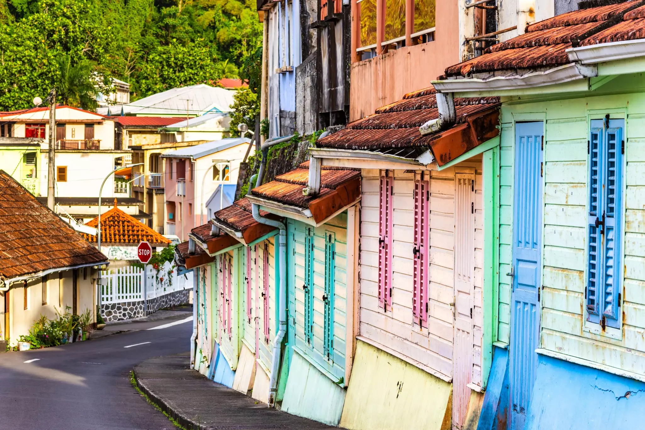 Colorful houses on a winding uphill road