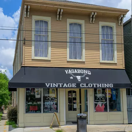 The facade of a clothing store on a sunny day.