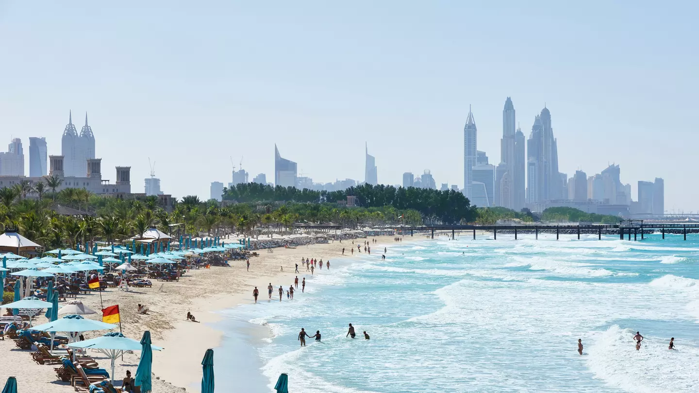 People in the water at Jumeirah Beach with the Dubai skyline in the distance ©R.A.R. de Bruijn Holding BV/Shutterstock
