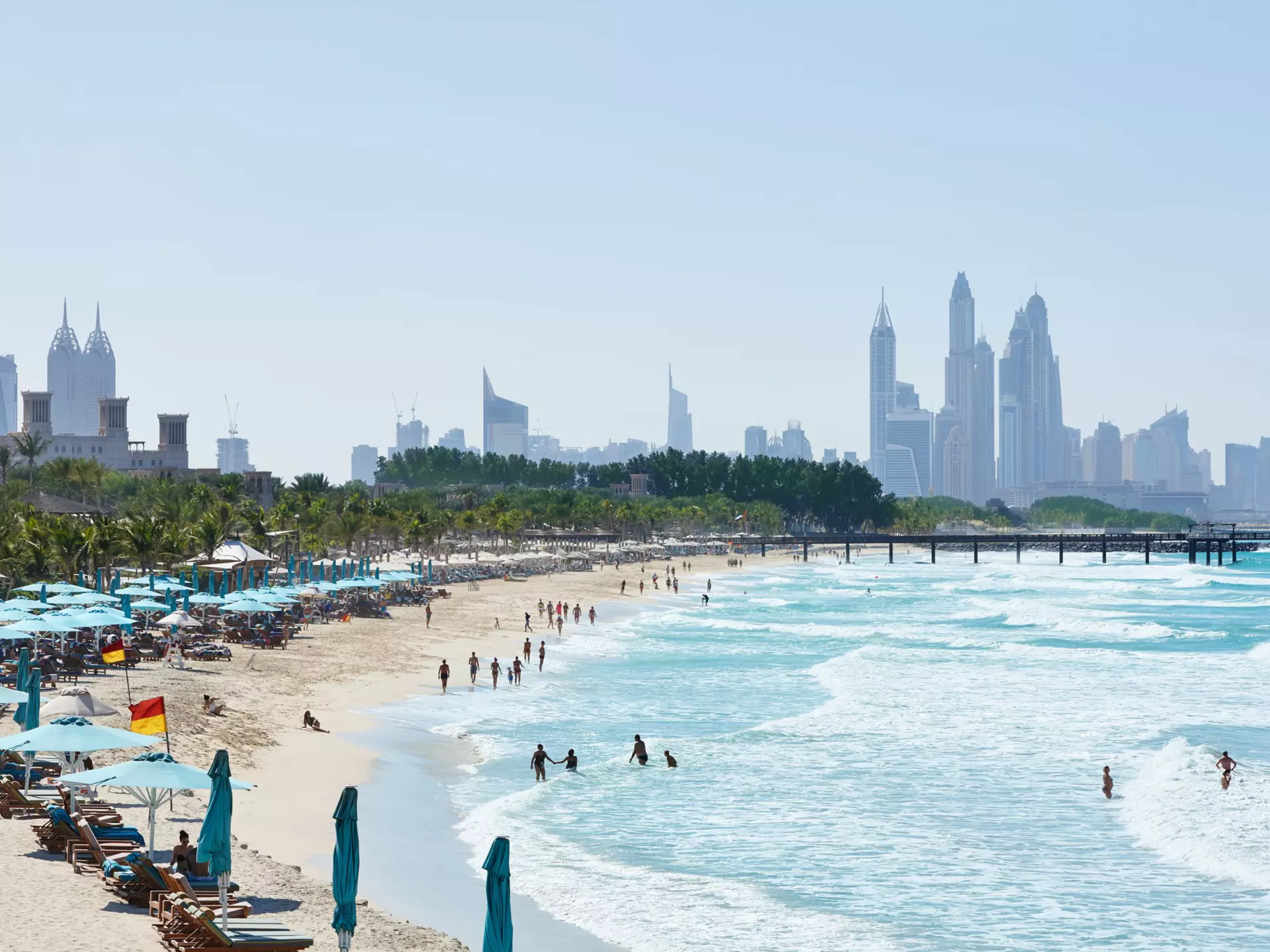 People in the water at Jumeirah Beach with the Dubai skyline in the distance ©R.A.R. de Bruijn Holding BV/Shutterstock