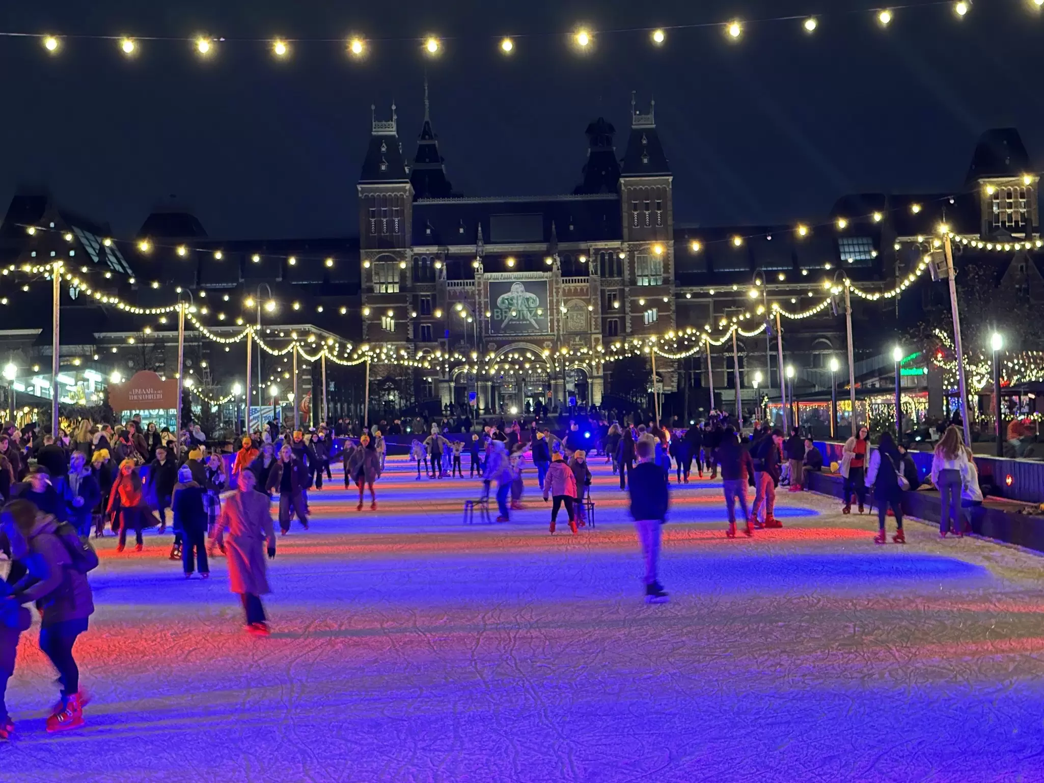 Ice skating rink at night with bright colorful lights and happy people enjoying Christmas activity. Museumplein , Amsterdam 15 November 2024, License Type: media, Download Time: 2025-12-12T11:40:23.000Z, User: pinkjozie64, Editorial: true, purchase_order: 65020 - Marketing or Sales - this includes sponsored articles, job: Global Publishing WIP (for books) , client: Amsterdam 14, other: Jo-anne Riddell