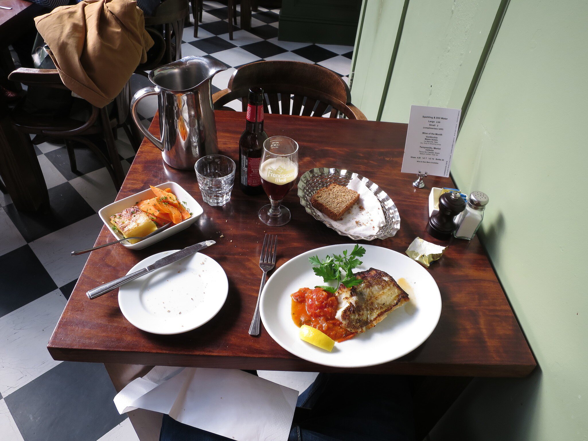 Table setting of food and beer at the Farmgate Cafe at the English Market, Cork, Ireland.