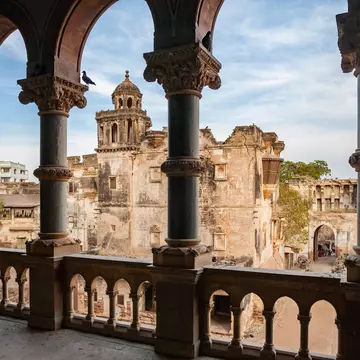 Aina Mahal and courtyard seen from a decorated balcony of Prag Mahal. Gujarat, India.