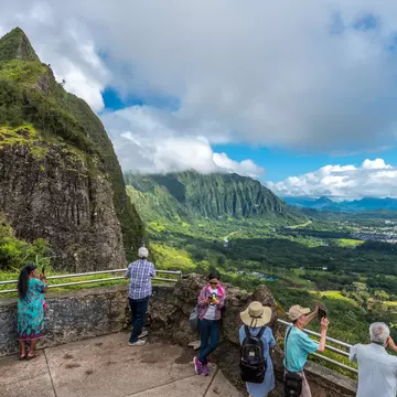 Nu'uanu, Hawaii, Oahu - May 28, 2017: tourists and island visitors gaze at the view of the winward side of oahu from the pali lookout, a section of the windward cliff of the Ko?olau mountain range
