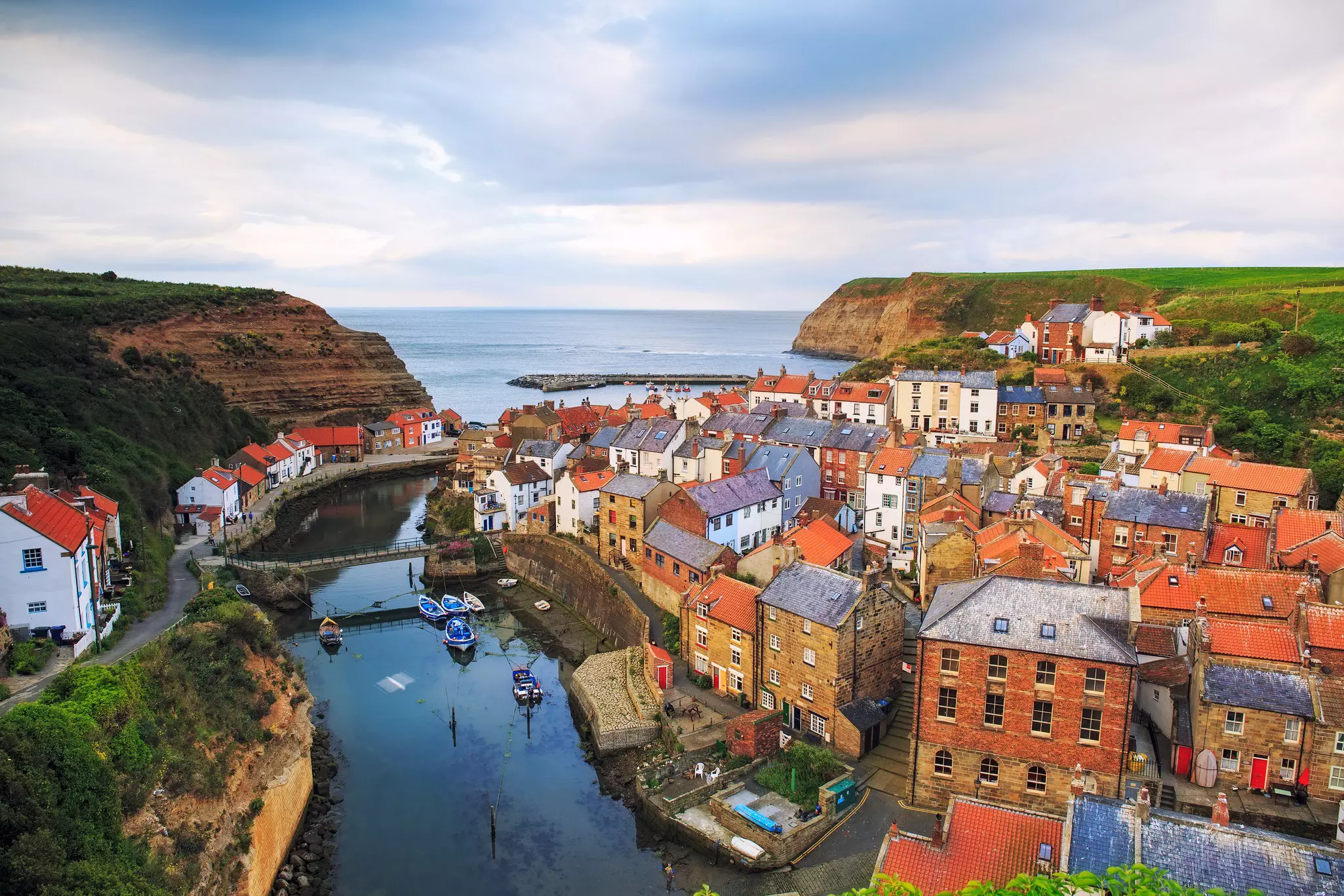 Colorful houses next to the sea in the village of Staithes in Yorkshire.