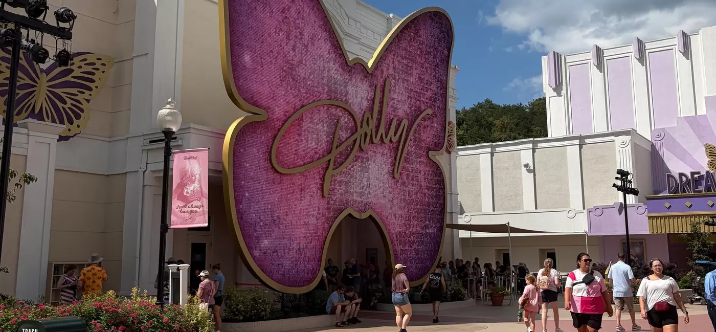 The butterfly-adorned entrance of the Dolly experience at Dollywood. 