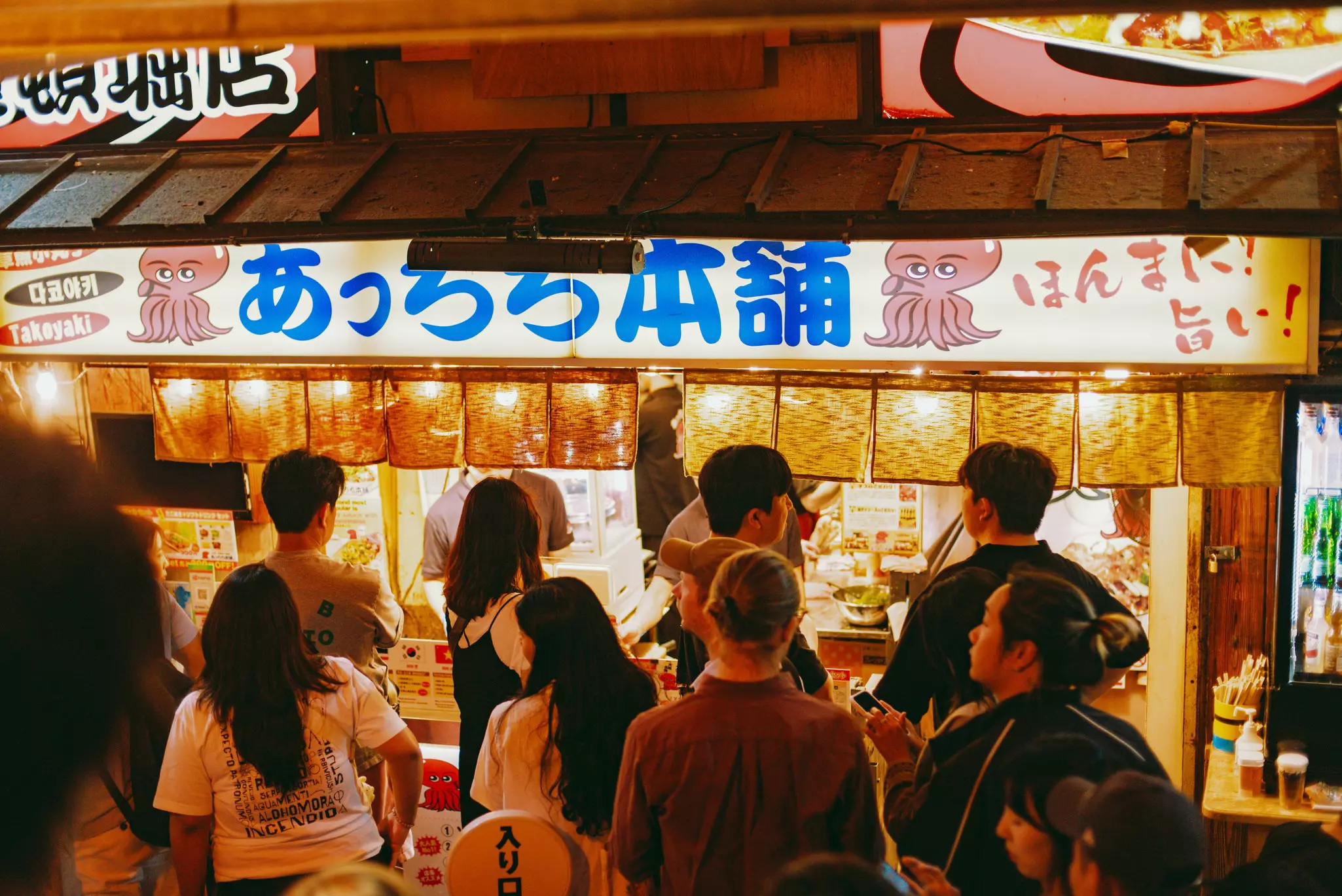 People lined up at a street stall