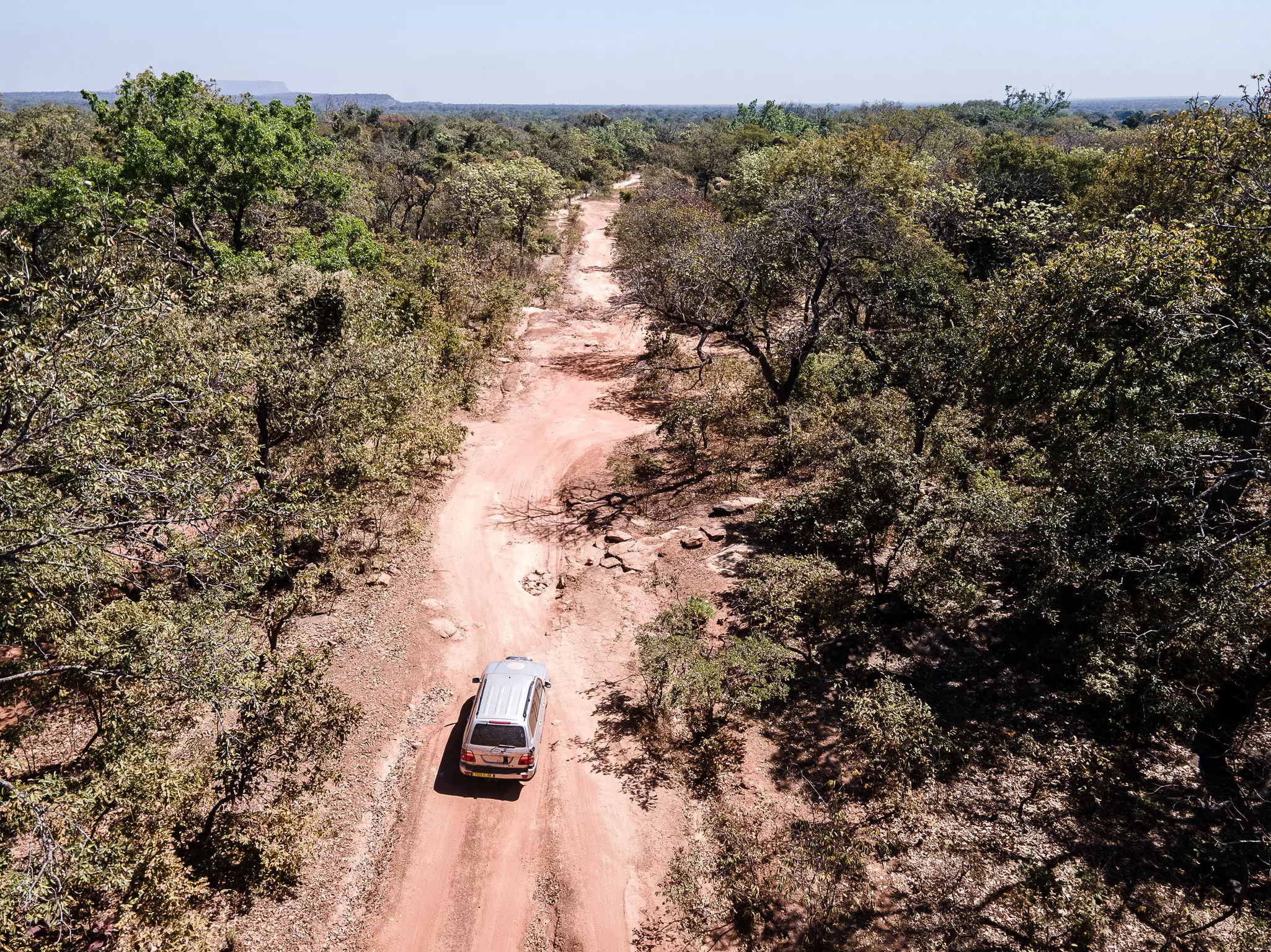 This is an aerial view of the only road connecting Guinea Bissau and Guinea, the main highway at their shared border © Juan Martinez / Lonely Planet