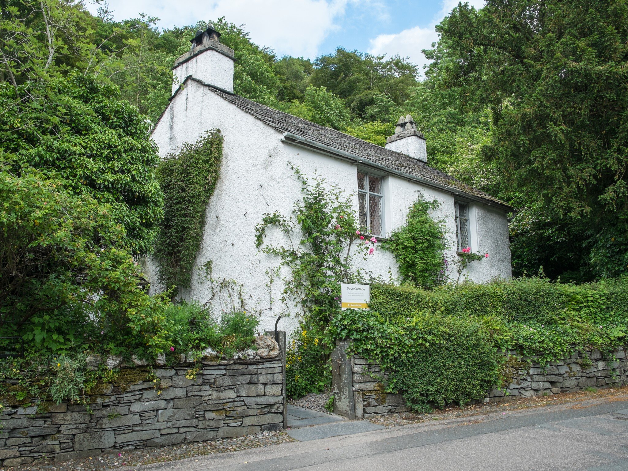 Grasmere, Lake District, UK - June 2017: Dove Cottage - picturesque home of the poet William Wordsworth.