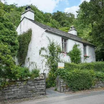 Grasmere, Lake District, UK - June 2017: Dove Cottage - picturesque home of the poet William Wordsworth.