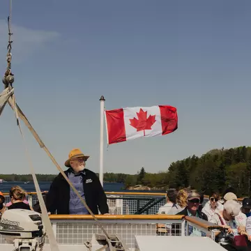 Lunch cruise aboard the historic Wenonah II Muskoka Steamship, part of the iconic Muskoka Steamships fleet, offering a journey through the rich history and natural beauty of Lake Muskoka. The dock is located at Muskoka Wharf in Gravenhurst, Canada.