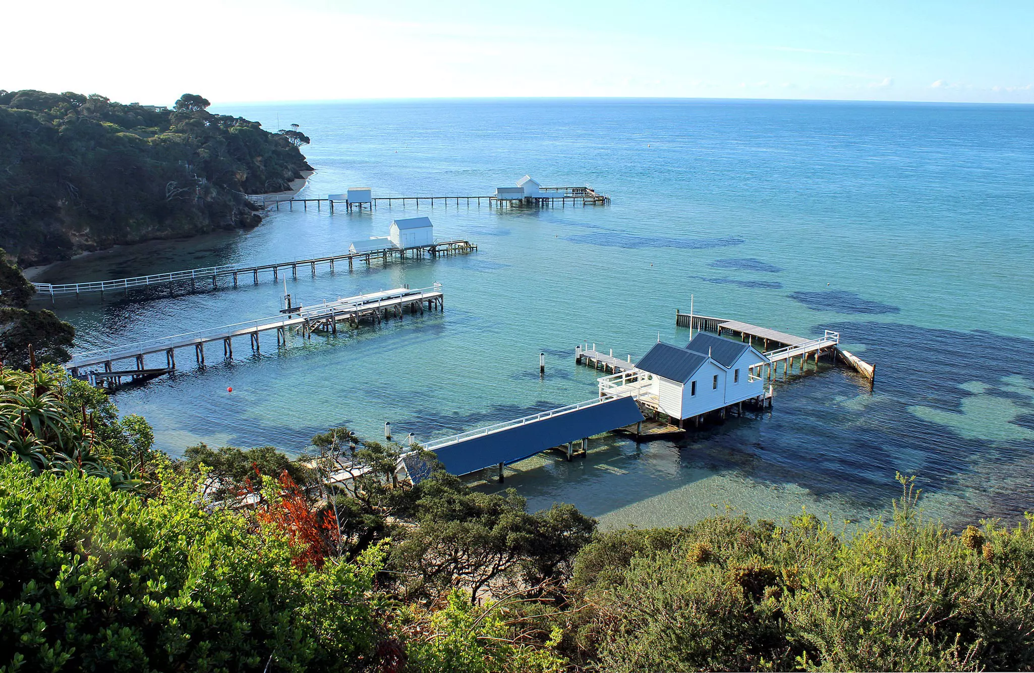 Piers in clear water, as seen from Millionaires Walk in the Mornington Peninsula, Sorrento