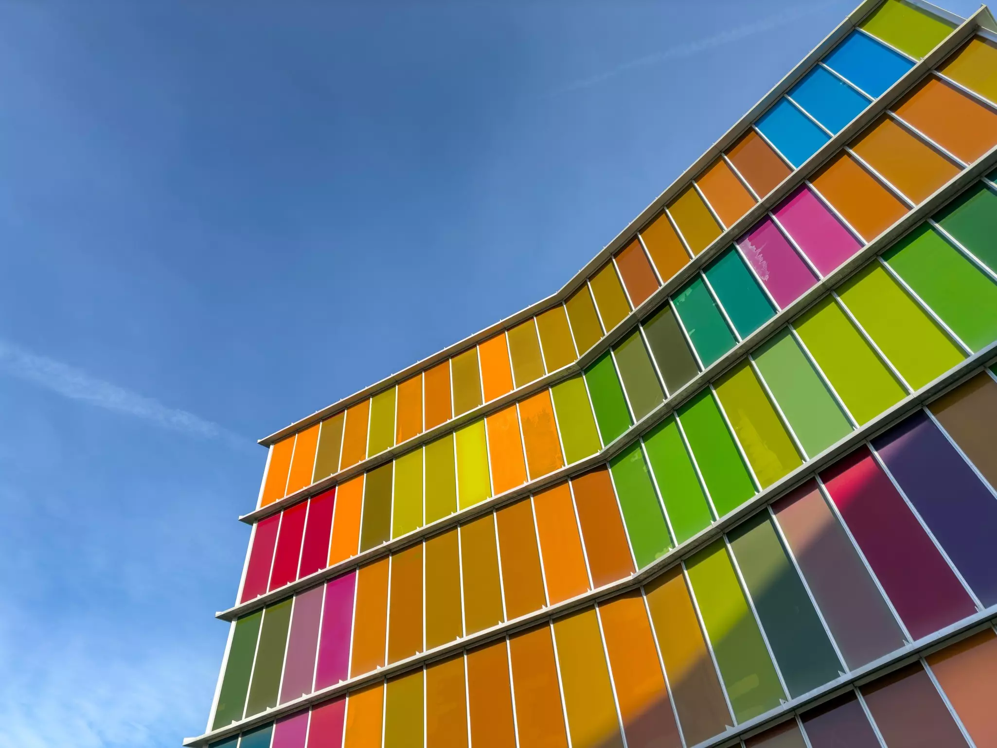Brightly colored windows and panels on the exterior of a museum