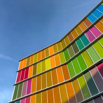 Brightly colored windows and panels on the exterior of a museum