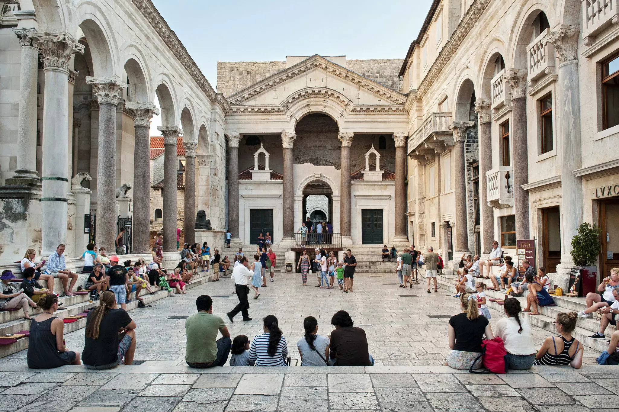 Roman temple in Split in Croatia with many groups of visitors