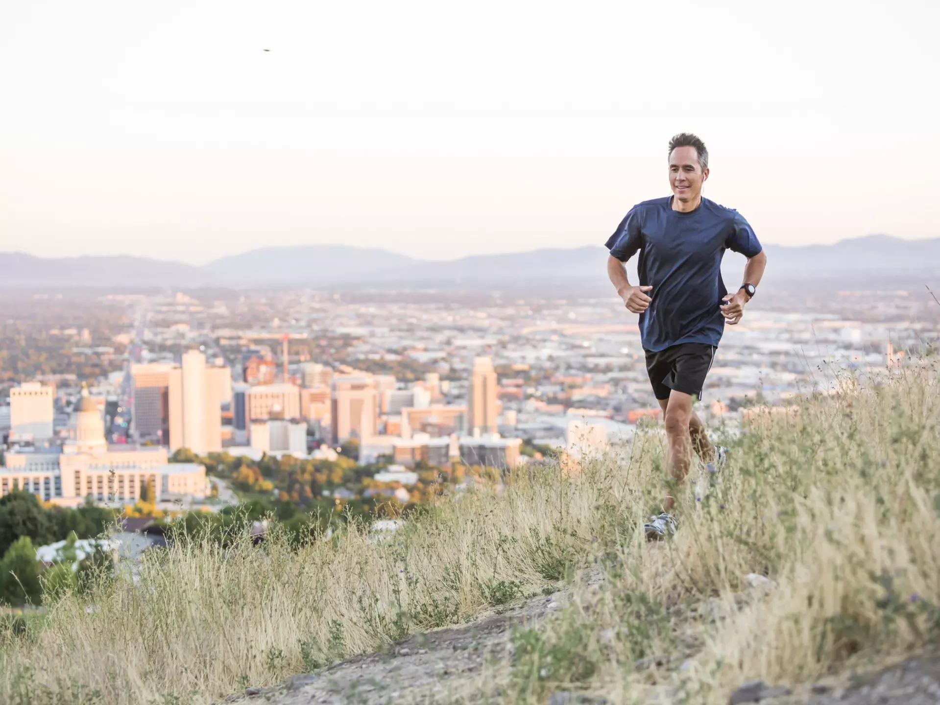Running on a hilltop over Salt Lake City, Utah, United States