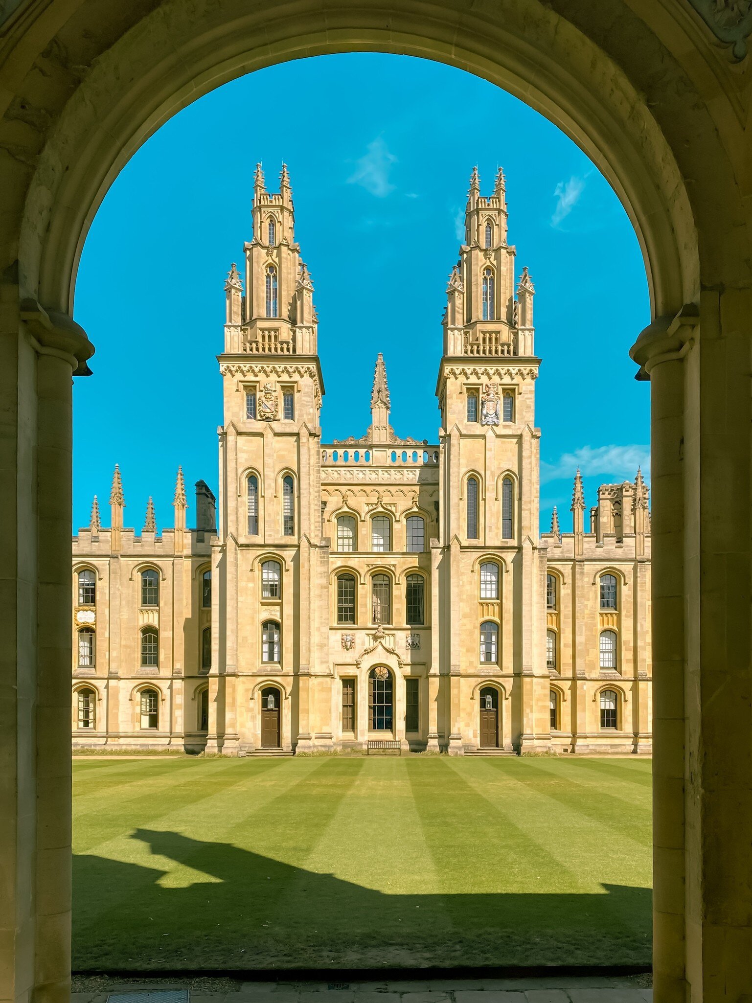 Exterior view of All Souls College, a part of the University of Oxford in the UK, on a sunny day.