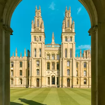 Exterior view of All Souls College, a part of the University of Oxford in the UK, on a sunny day.