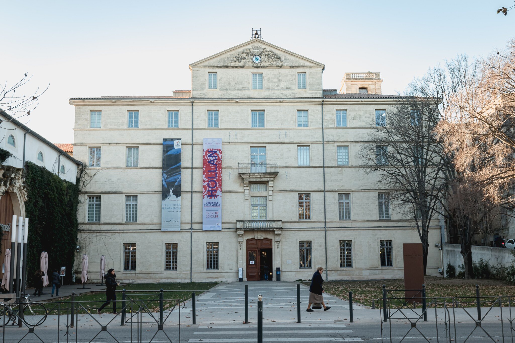 Montpellier, France - January 2, 2019: architectural detail of the Fabre museum next to the Place de la Comedie where people pass on a winter day; Shutterstock ID 1628380093; your: Sloane Tucker; gl: 65050; netsuite: Online Editorial; full: POI