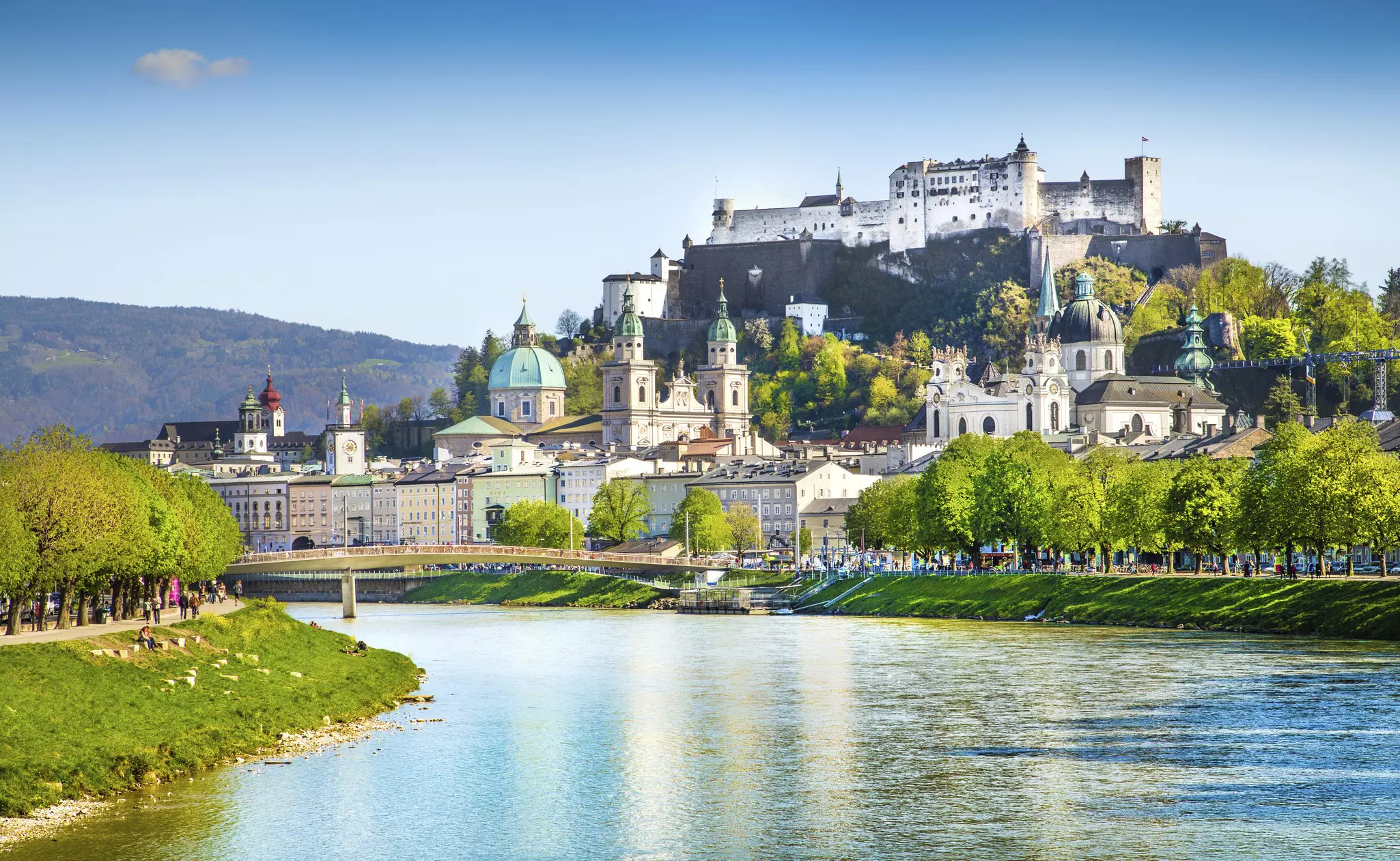 View of Salzburg skyline with Festung Hohensalzburg and Salzach river in summer