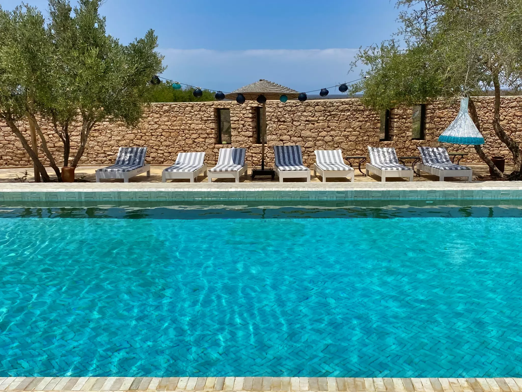 Relaxing by the pool at Jardins de la Villa Moroc © Sally Kirby / Lonely Planet