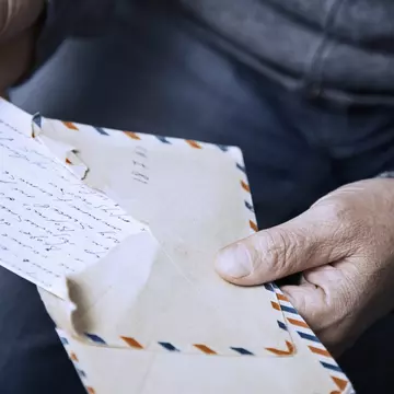The idea of sending letters might seem passé, but during a time of social distancing, getting a penpal can help ease the isolation. Arman Zhenikeyev / The Image Bank / Getty Images
