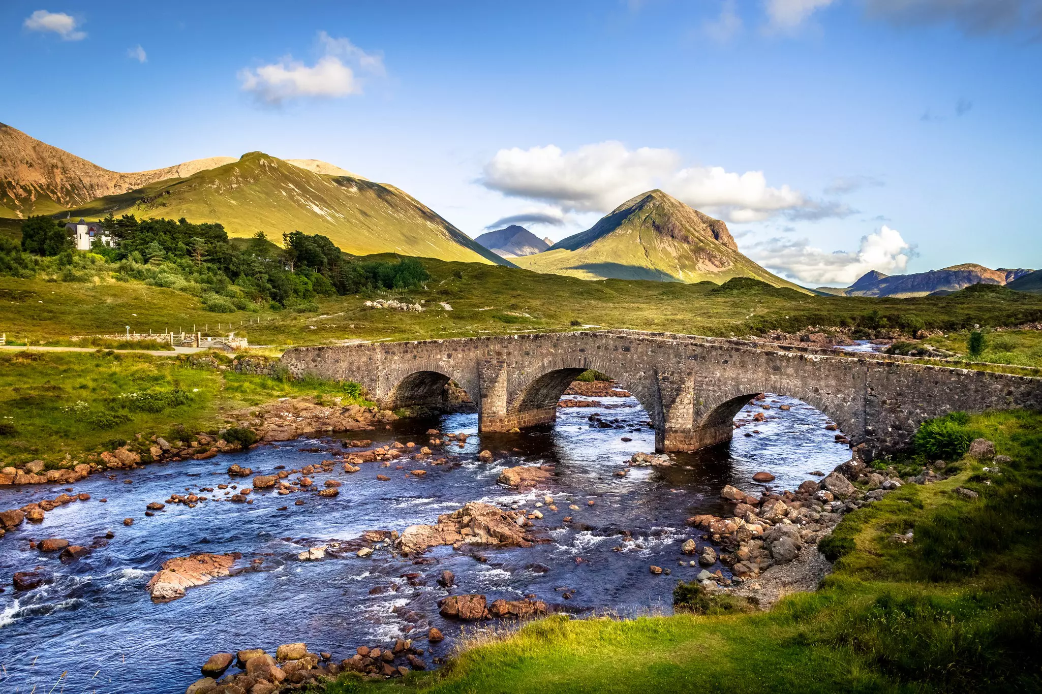 Old brick bridge crossing river in Sligachan, Isle of Skye, Scotland.