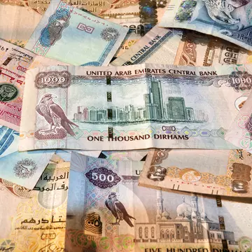 United Arab Emirates currency with notes spread on a table.
927096466
Value Added Tax, Cash, Paper Currency, Banking, Finance and Economy, Tax, Horizontal, Currency Symbol, Photography, Business, No People, Color Image, Finance, Currency, Persian Gulf Countries, Wealth, United Arab Emirates Currency, Making Money, dhiram, Commercial Activity, United Arab Emirates