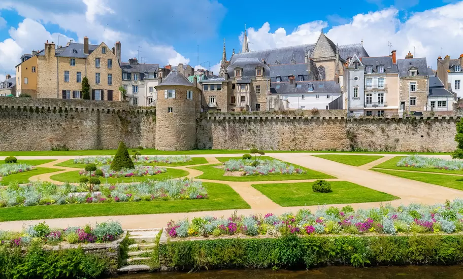 Vannes, France, May 20, 2019, medieval city in Morbihan, view of the garden of the ramparts, a public park, with the old city behind the walls