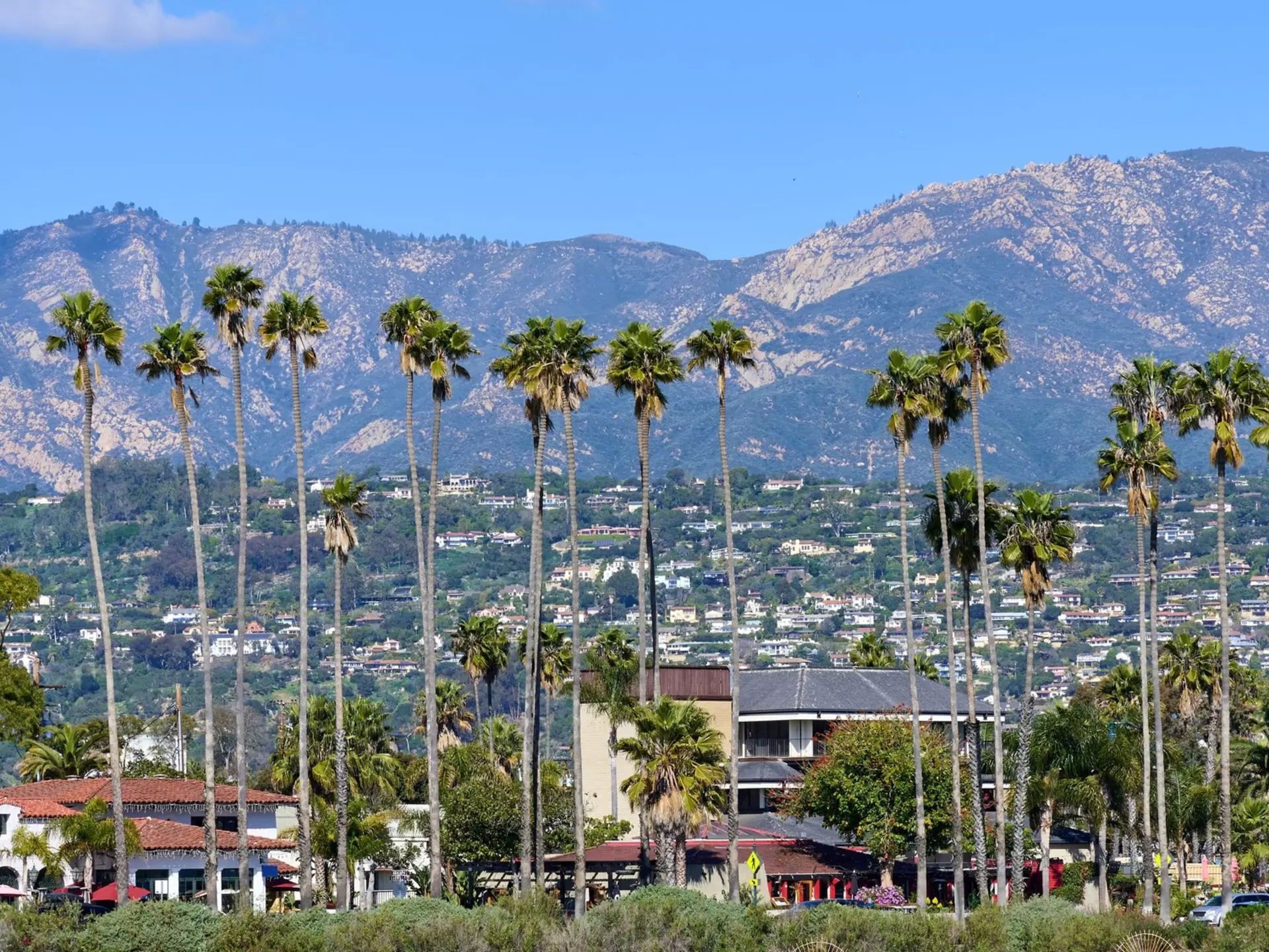 East Cabrillo Blvd in Santa Barbara, California, with the Riviera neighborhood and the Santa Ynez Mountains in the background. John Penney/Shutterstock