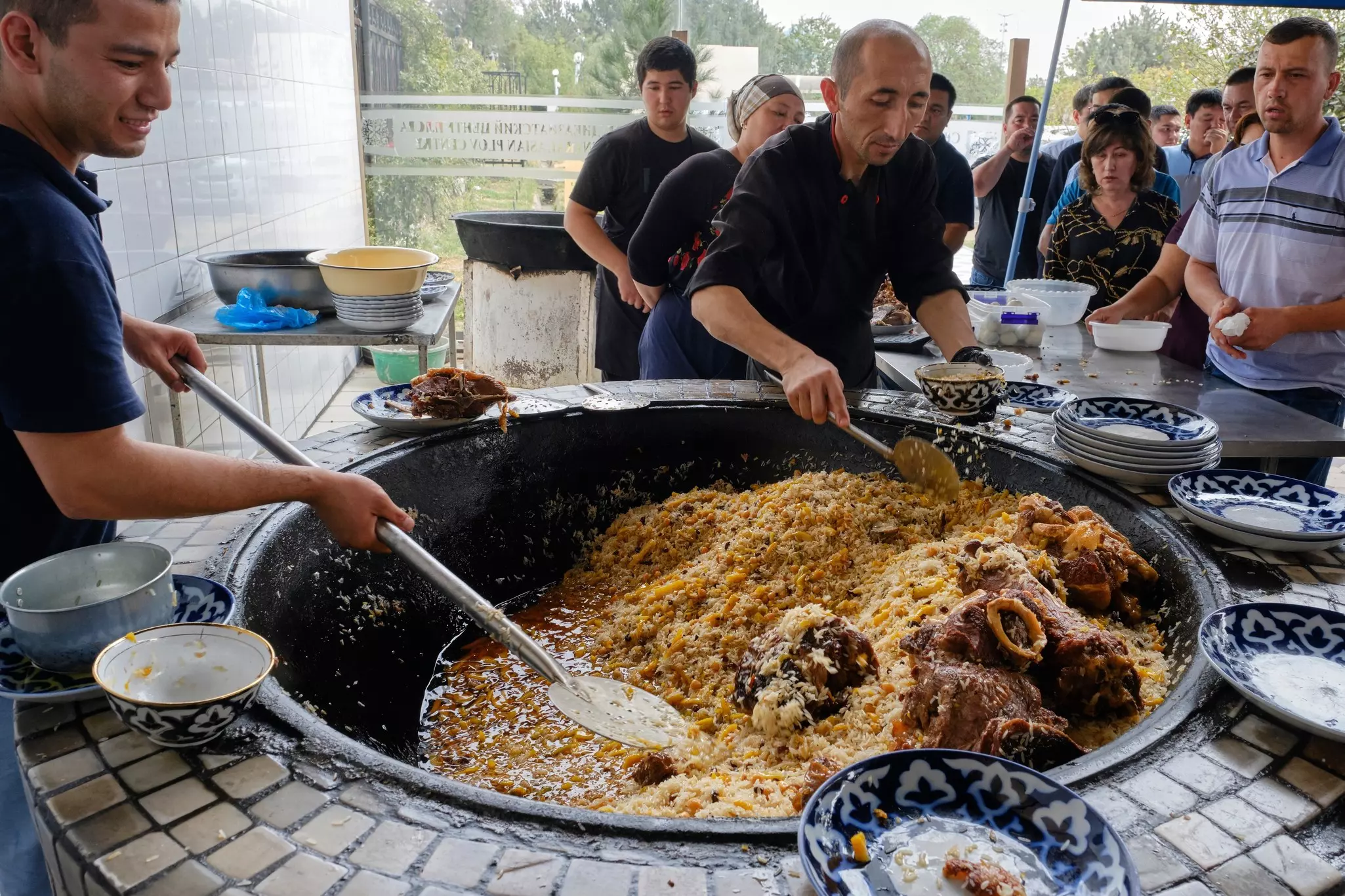 People wait to buy plov at the Central Asian Plov Centre in Tashkent, Uzbekistan.