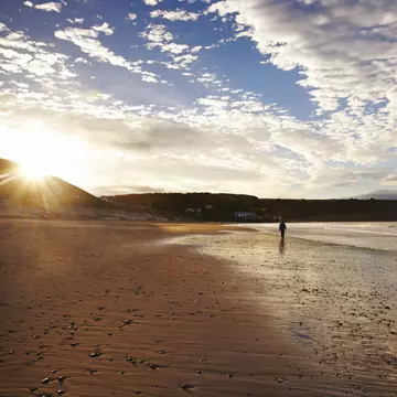 Deserted beach at sunrise.