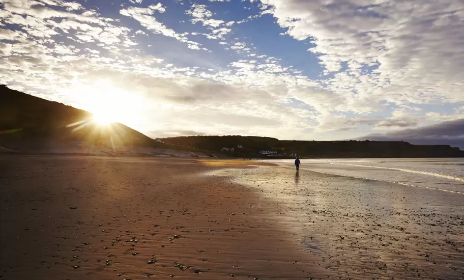 Deserted beach at sunrise.
