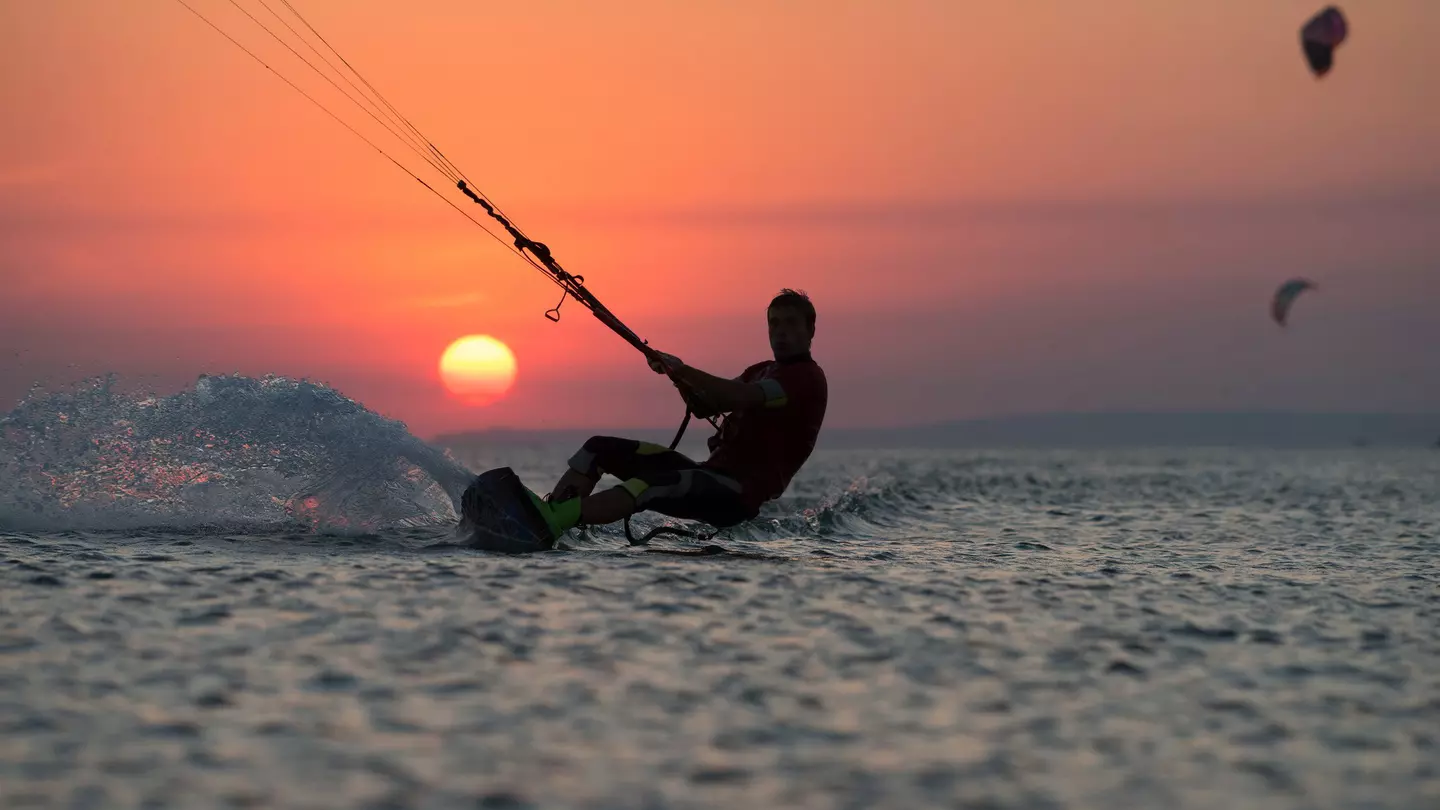 Kiteboarder at sunset off Mauritius