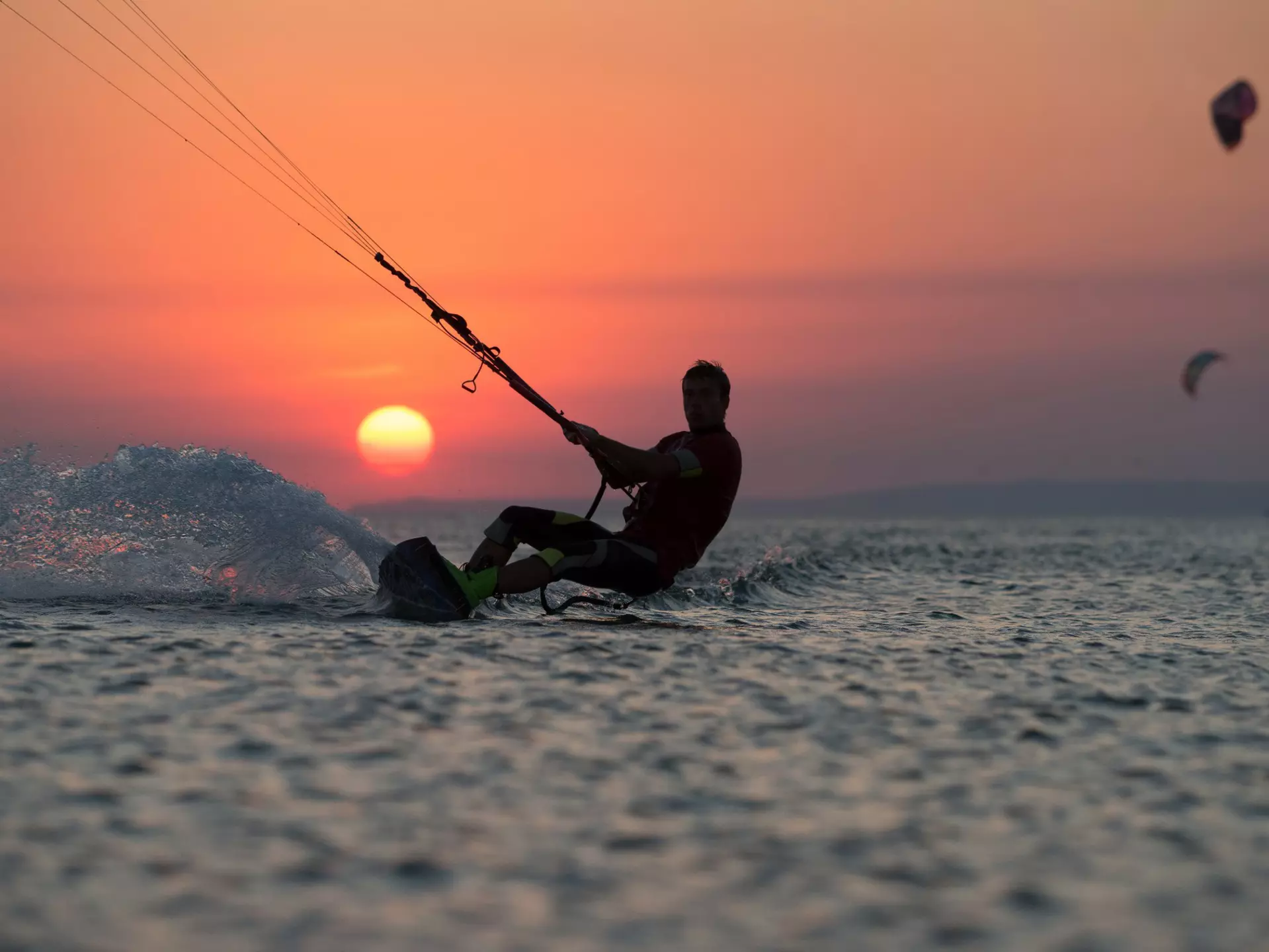 Kiteboarder at sunset off Mauritius