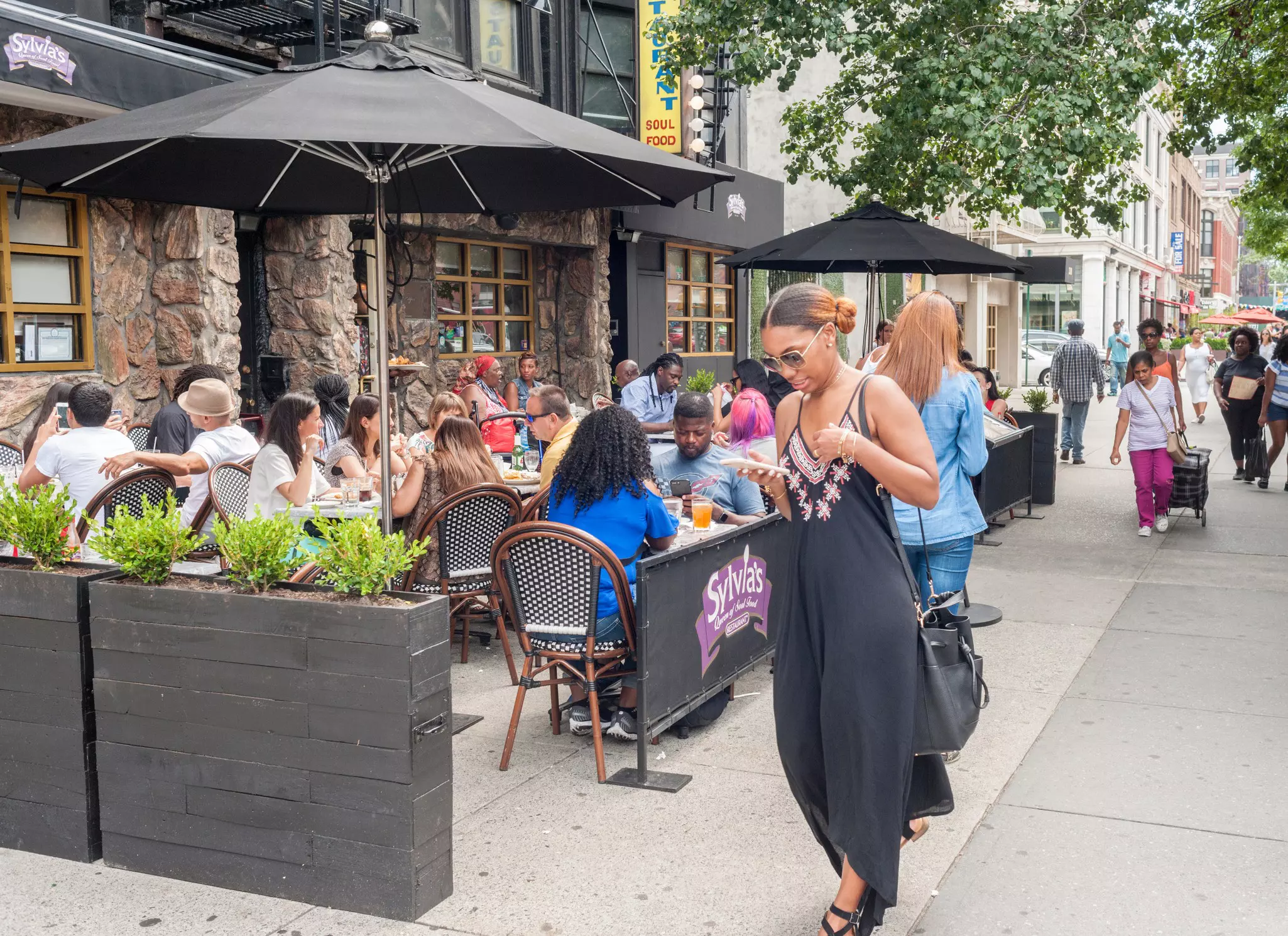 New York NY/USA-August 6, 2017 Al fresco dining outside the world-renowned Sylvia's restaurant in Harlem in New York; Shutterstock ID 1758950624;