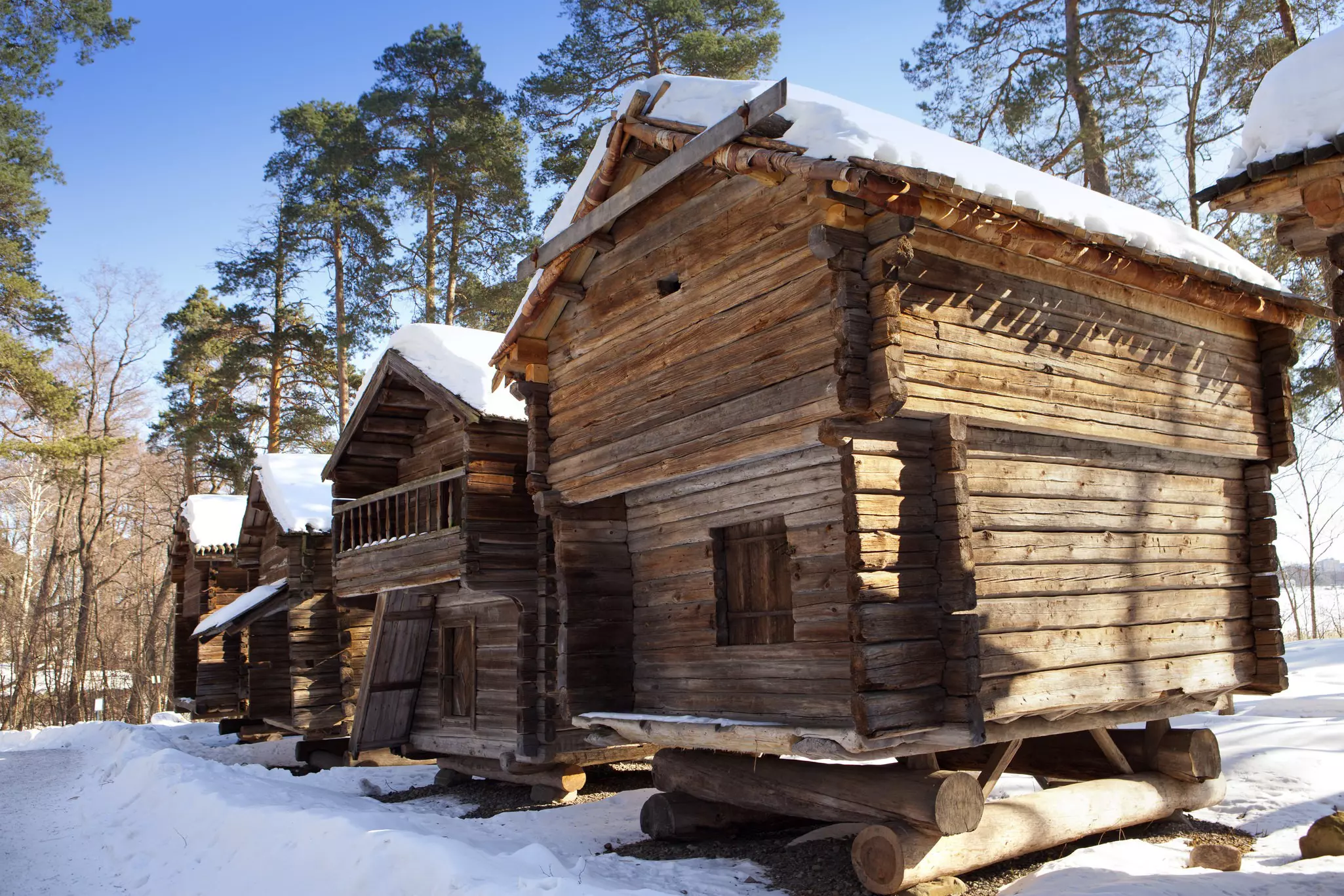 A rustic wooden house at an open-air folk museum in Finland.