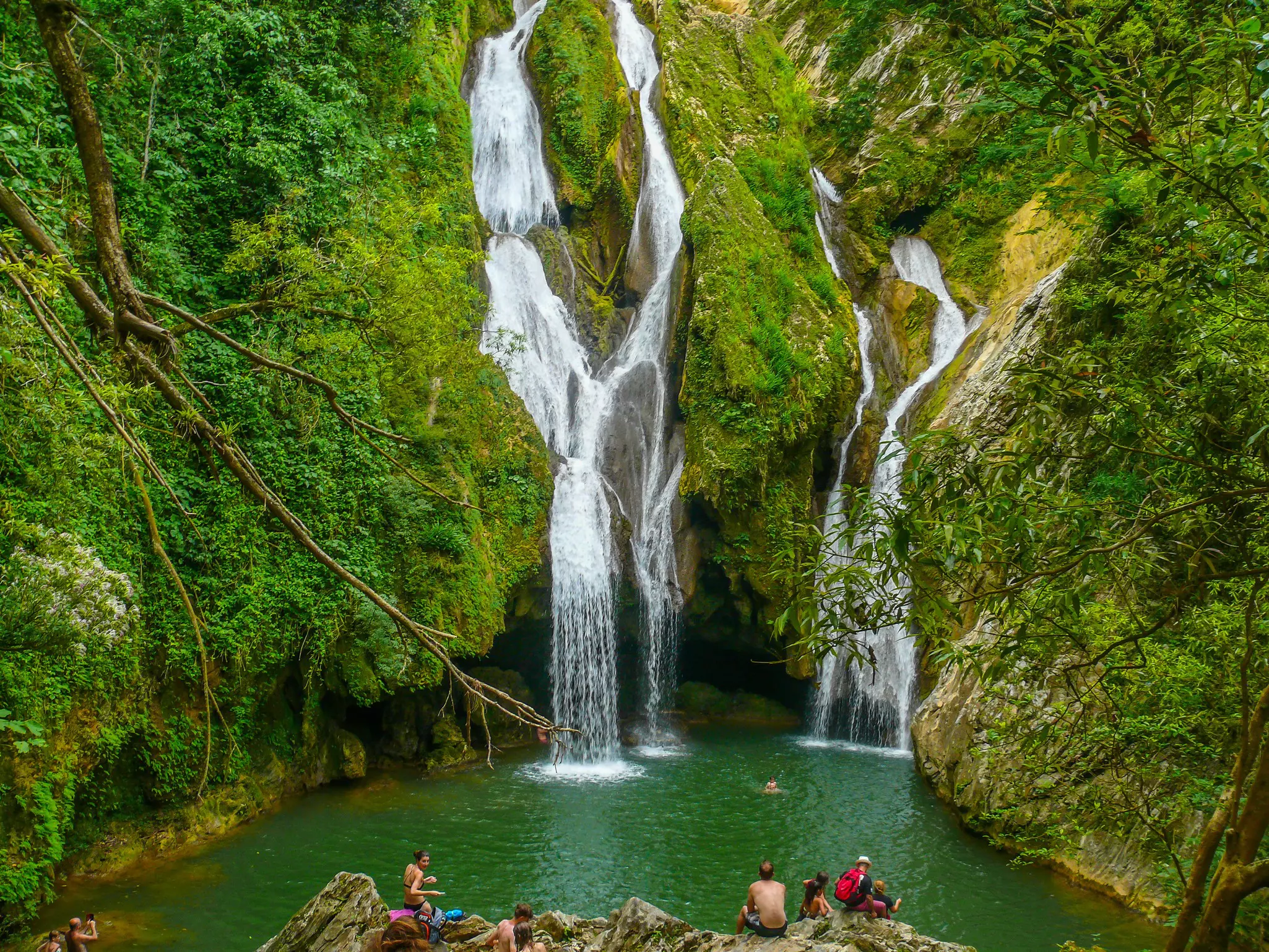 People swimming at Vegas grande Waterfall in Topes de Collante, Trinidad, Cuba.