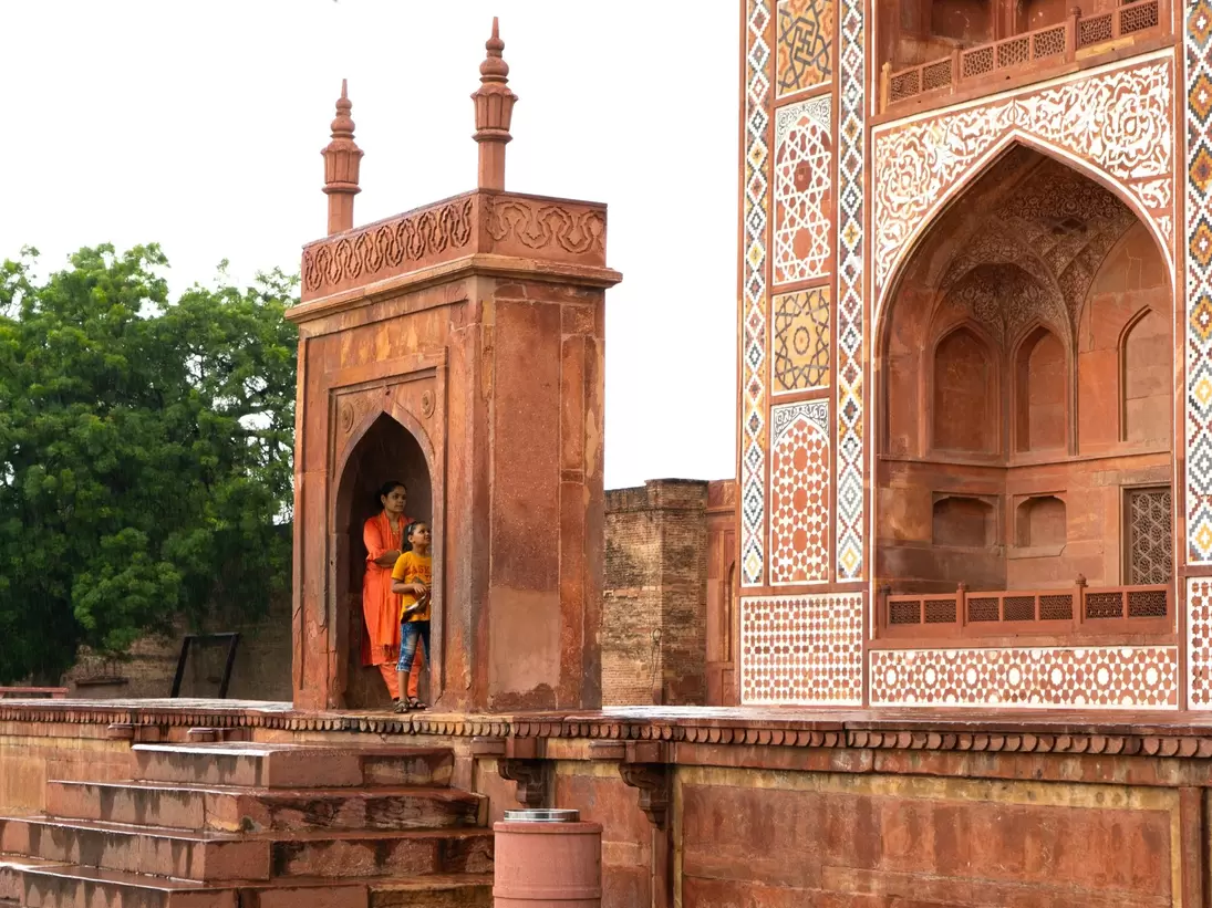 Tourists visit the Tomb of Akbar the Great in Agra, India.