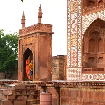 Tourists visit the Tomb of Akbar the Great in Agra, India.