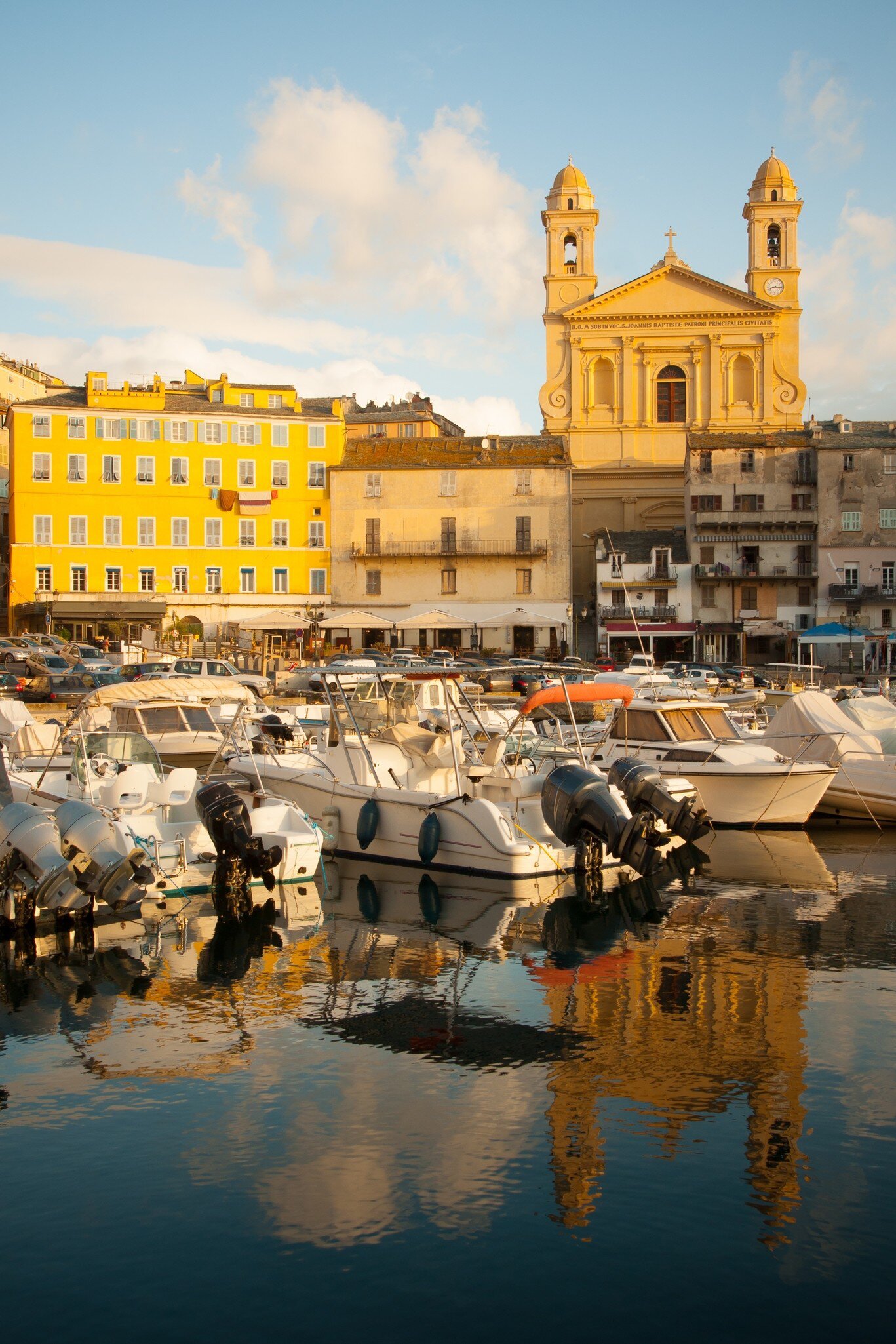 Scene of the old port (the Vieux Port) with the Église St-Jean-Baptiste in Bastia, Corsica, France.