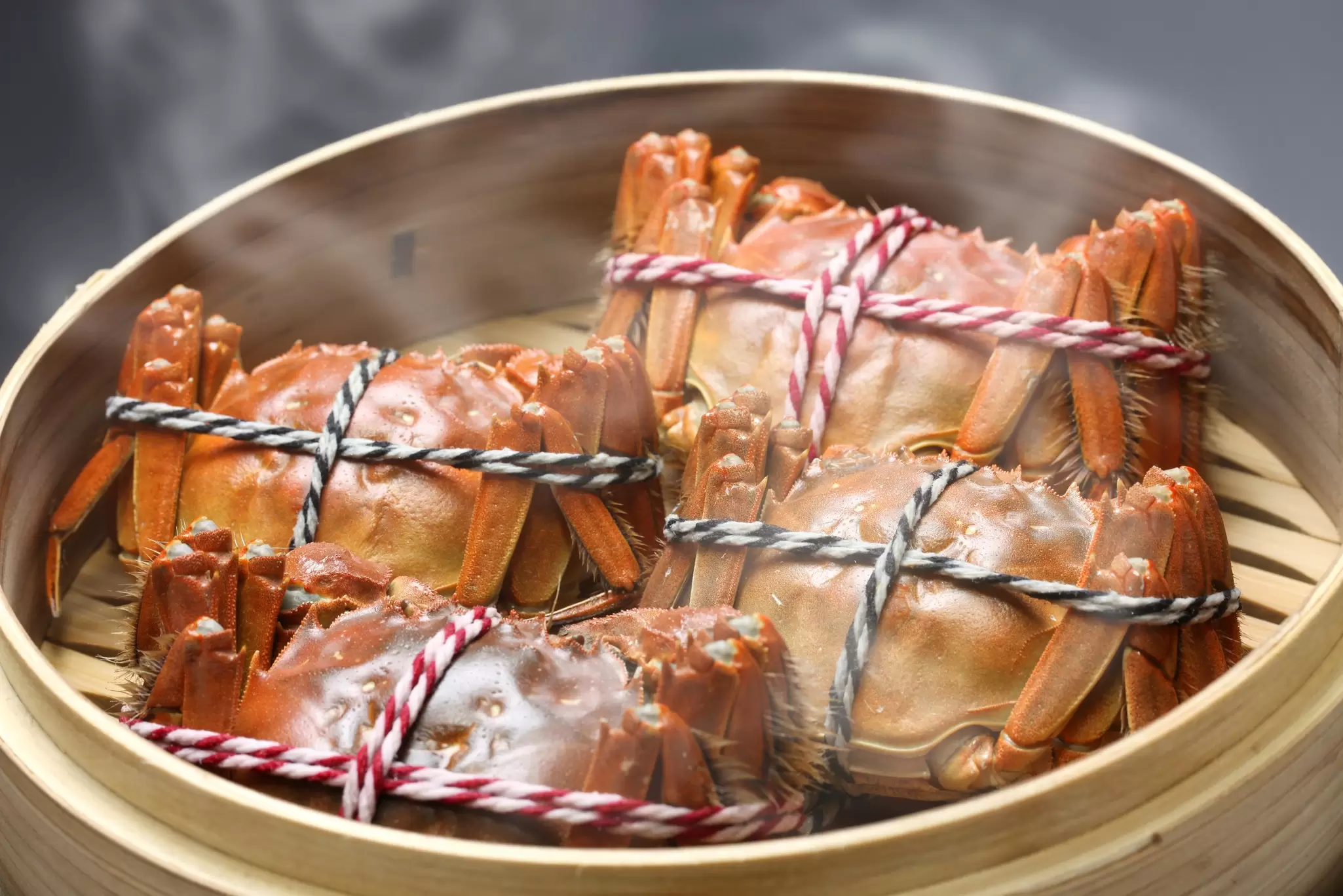 A bamboo steamer of hairy crabs in Shanghai, China. 
