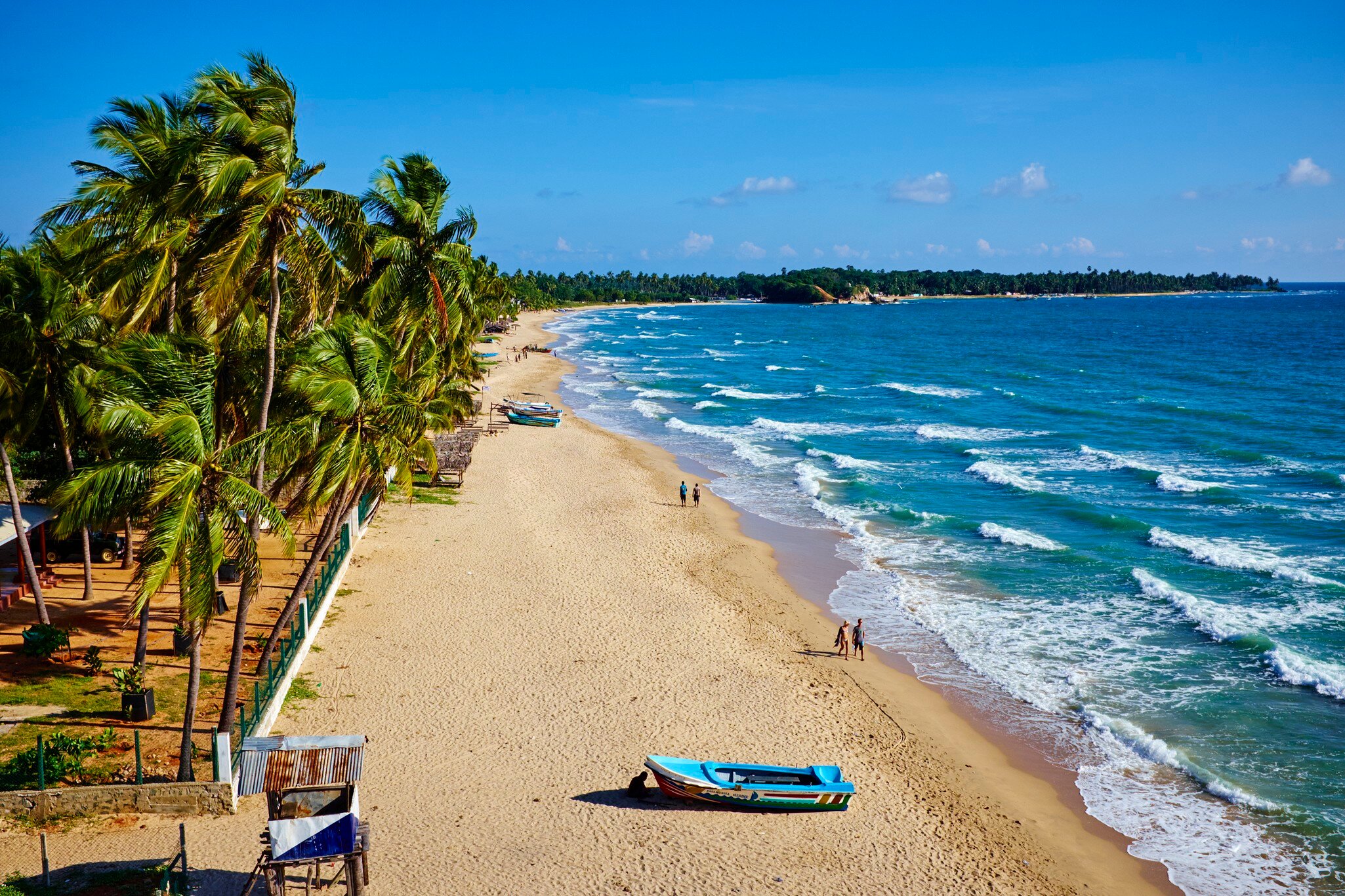 Aerial of Uppuveli, with the ocean on the right.