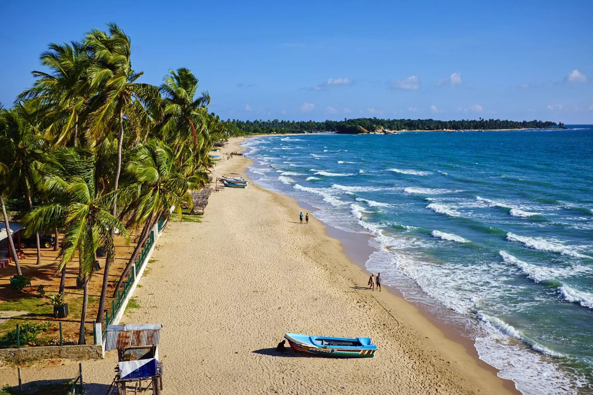 Aerial of Uppuveli, with the ocean on the right.