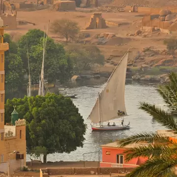 A felucca boat sailing on the River Nile near Aswan, Egypt. 