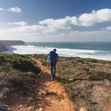A hiker along the Fisherman’s Trail, part of the Rota Vicentina, Portugal. Cat_s/Shutterstock