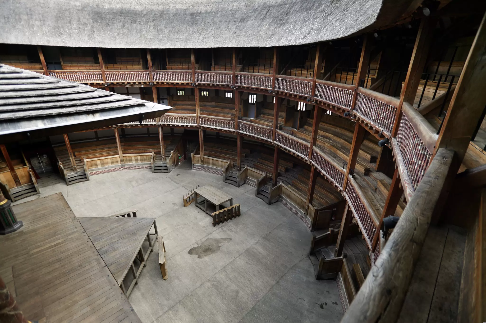 A round theatre space with wooden terraces