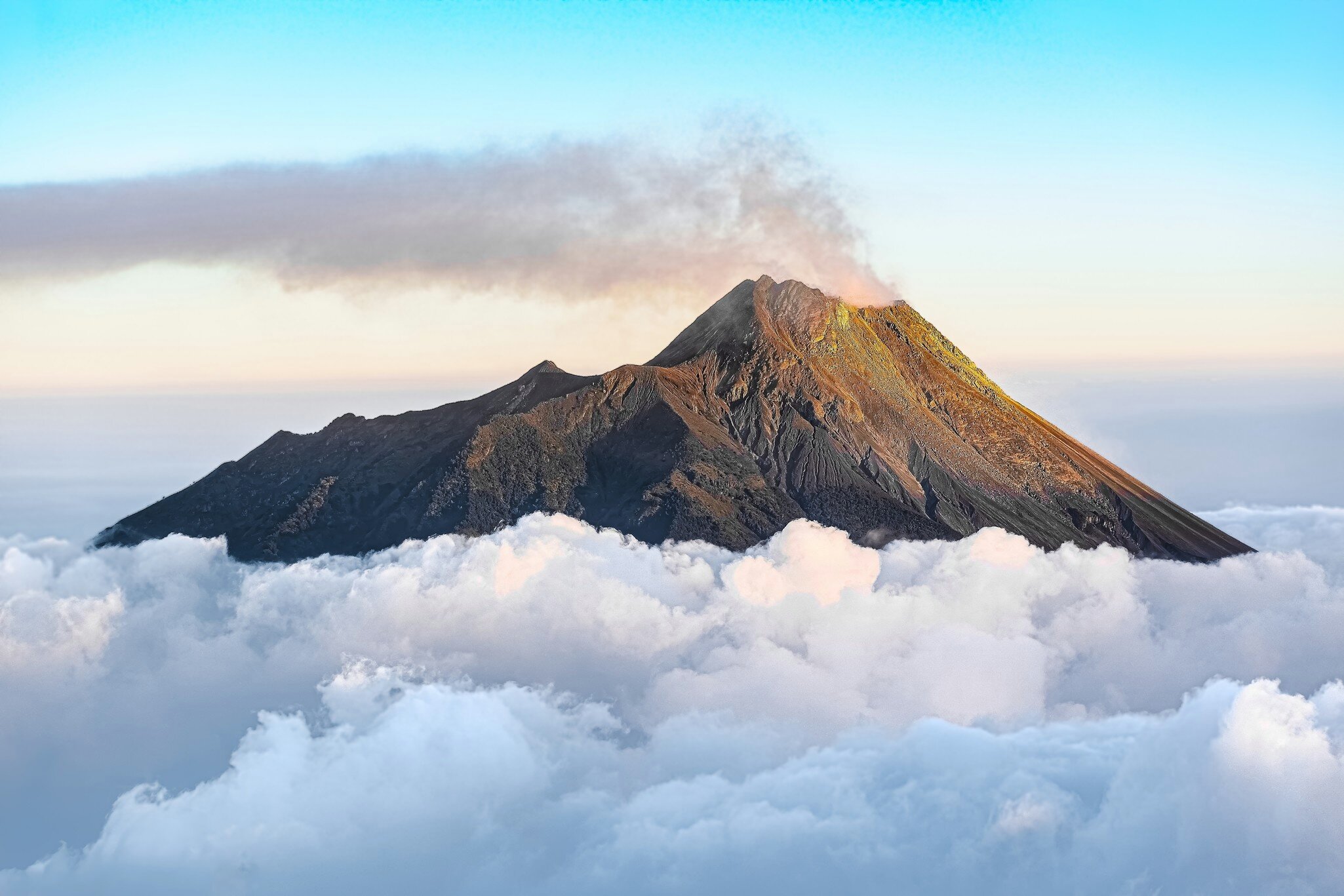 Top of Mount Merapi Summit Volcano above the clouds viewed from Mount Merbabu, License Type: media, Download Time: 2025-02-25T21:34:25.000Z, User: joebindloss38, Editorial: false, purchase_order: 65050 - Digital Destinations and Articles, job: Online Editorial, client: 10 best hikes in Indonesia, other: Joe Bindloss