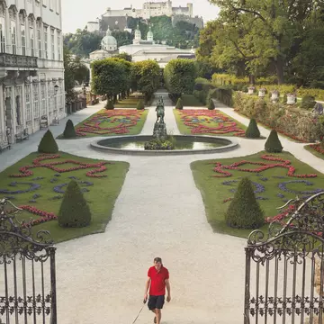 austria, europe, jonathan stokes, jonathan stokes photography, luxury, photograhpy, photography, salzburg, tourism, travel, austria europe jonathan stokes jonathan stokes photography luxury photograhpy photography salzburg tourism travel
Man walks his dog through the gardens at Mirabell Palace (Schloss Mirabell).