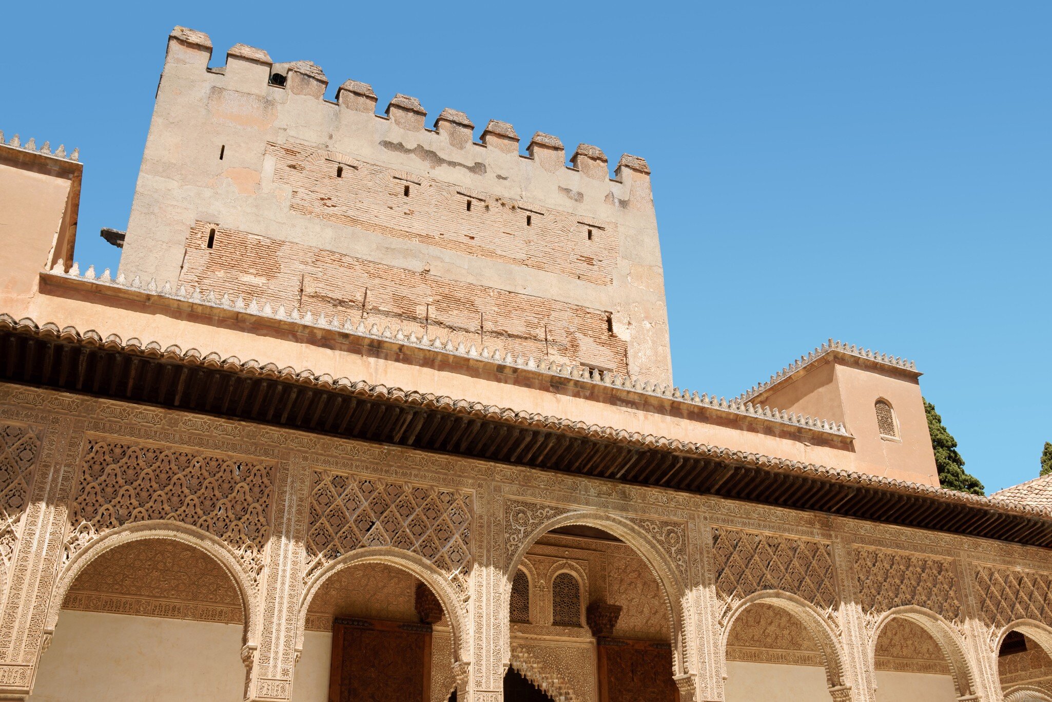 Detail of Comares Tower and Courtyard of the Myrtles or Court of the Blessing in the Alhambra of Granada, Spain